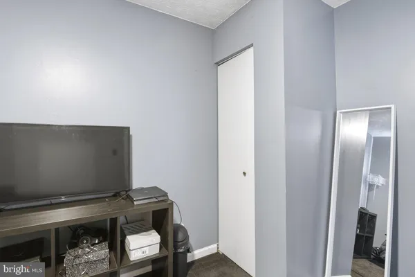 a room with furniture and a flat screen tv