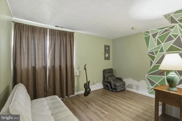 a room with furniture and a wooden floor