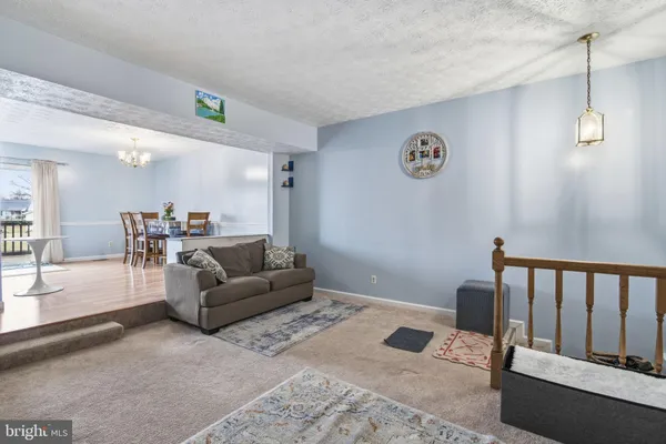 a living room with furniture and a table
