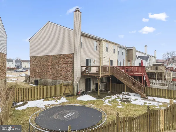a swimming pool with outdoor seating and yard