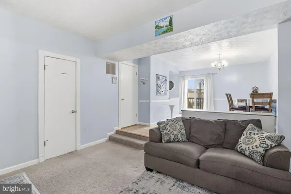 a living room with furniture and a couch