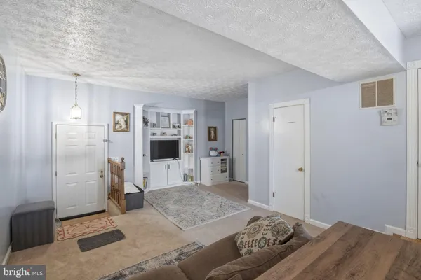 a bedroom with a bed and a television