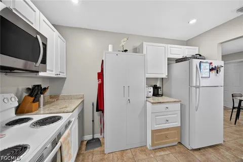 a kitchen with stainless steel appliances a refrigerator stove and sink