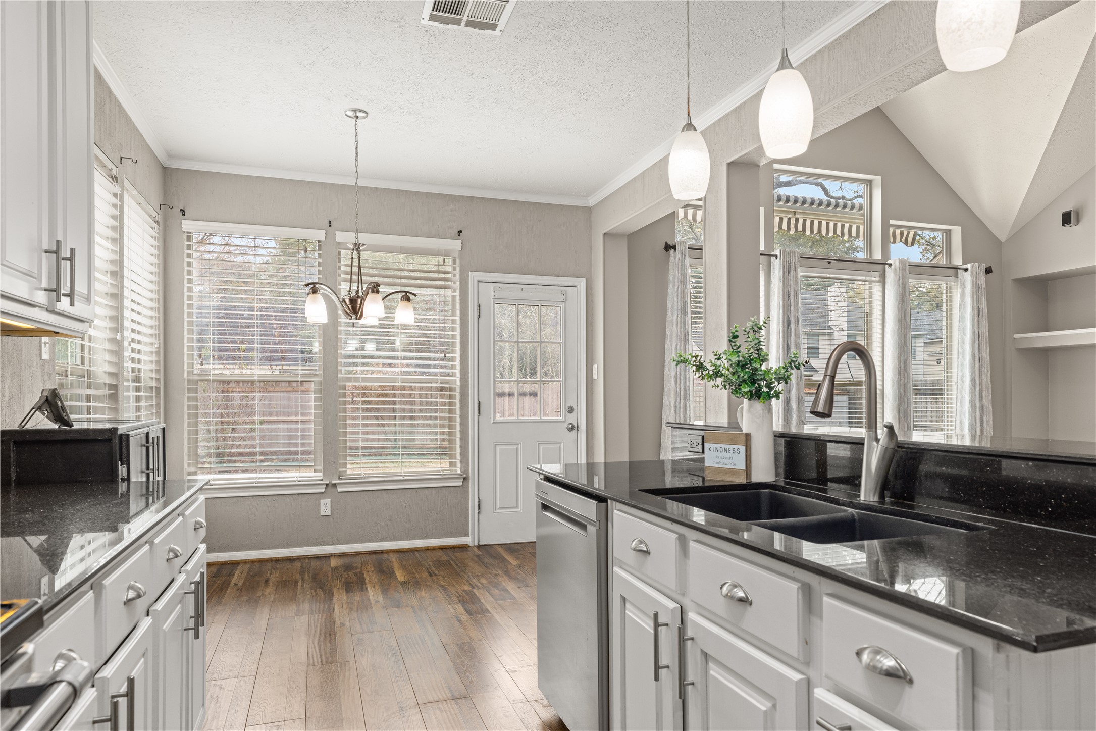 20823 Water Point Trail Humble, TX 77346 - Photo 16 of 43 a kitchen with granite countertop a sink and a counter top space