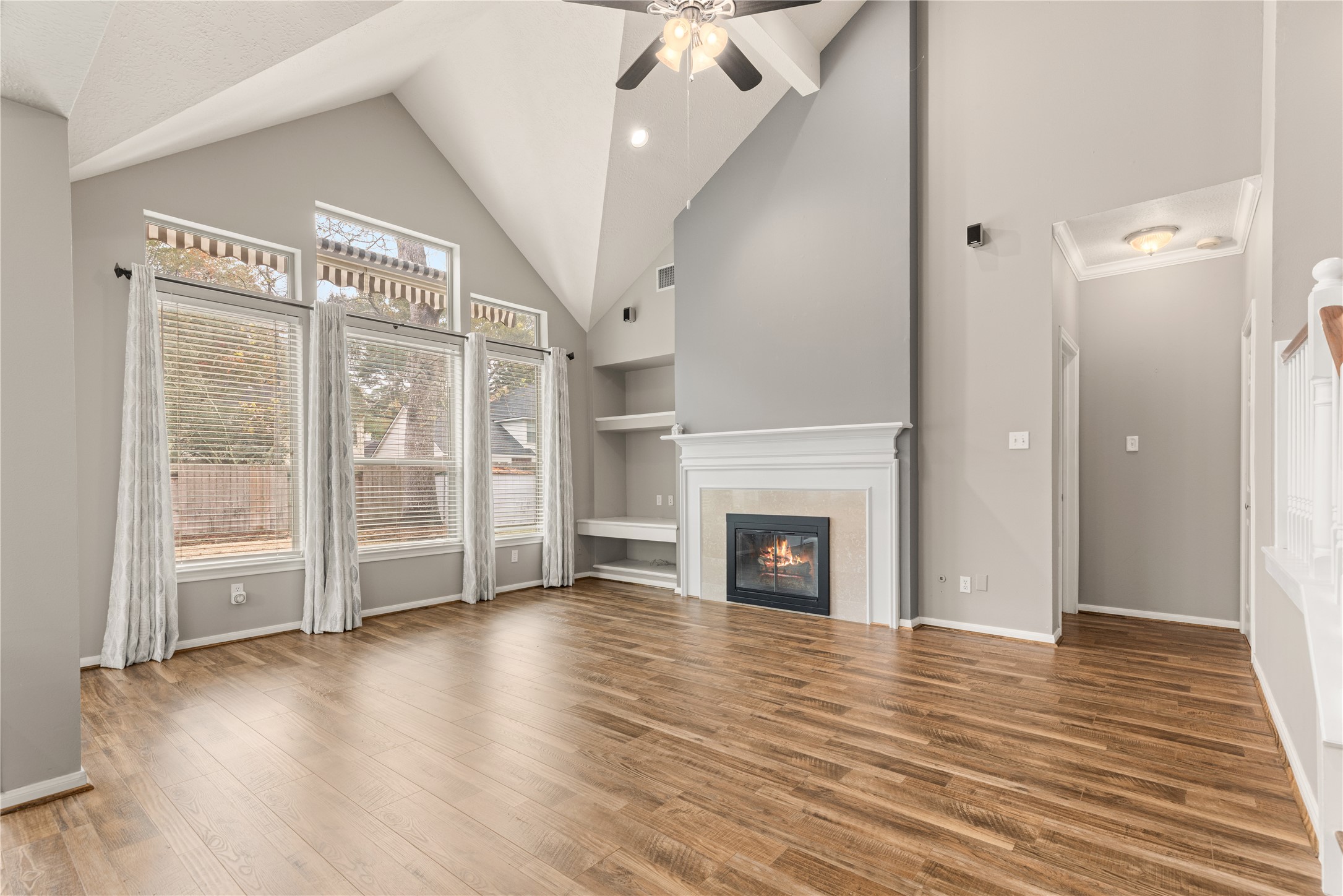 20823 Water Point Trail Humble, TX 77346 - Photo 8 of 43 a view of a livingroom with wooden floor a fireplace and window
