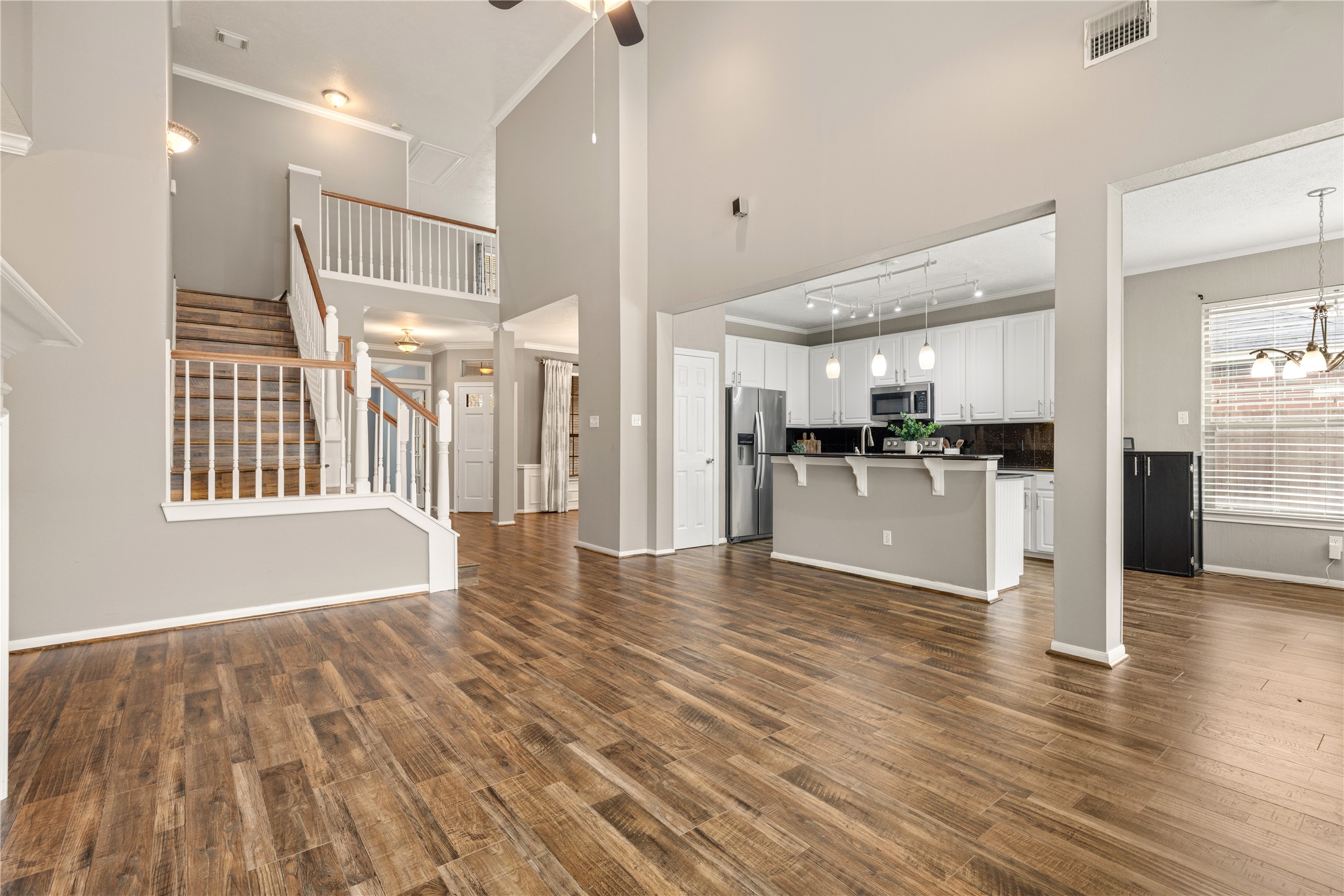 20823 Water Point Trail Humble, TX 77346 - Photo 10 of 43 a view of a kitchen with wooden floor and a kitchen