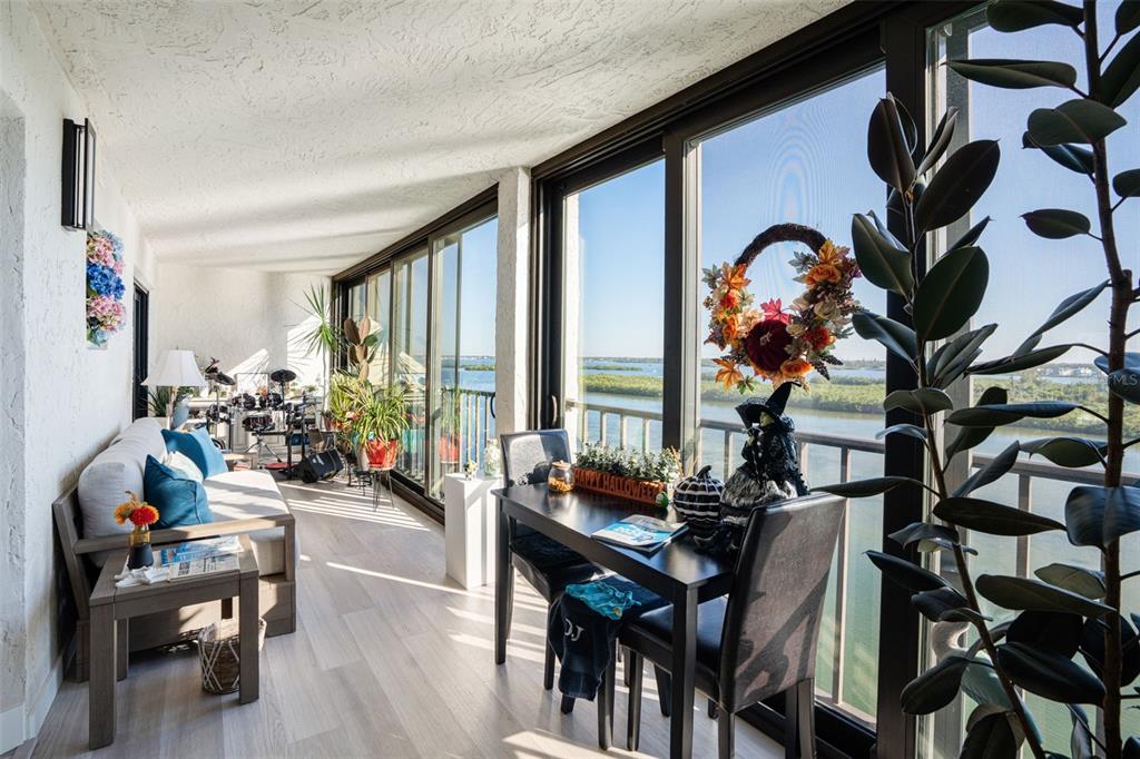 9397 Midnight Pass Road, Unit 905 Sarasota, FL 34242 - Photo 14 of 37 a living room with furniture and a potted plant