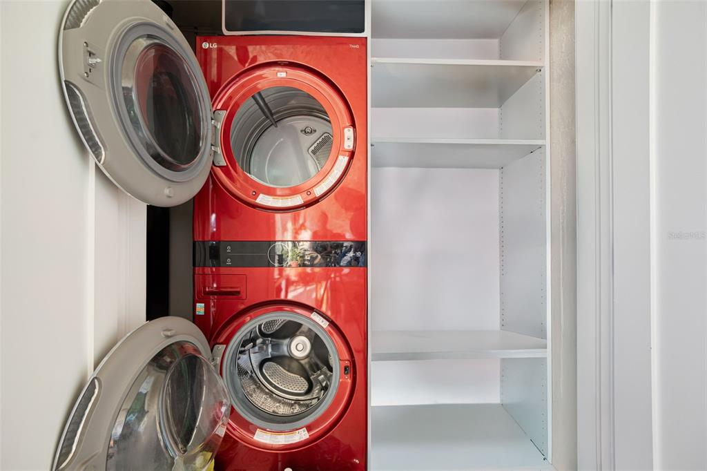 9397 Midnight Pass Road, Unit 905 Sarasota, FL 34242 - Photo 15 of 37 a utility room with dryer and washer