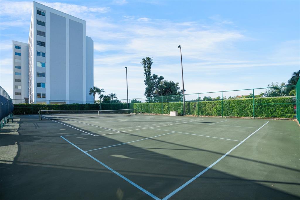 9397 Midnight Pass Road, Unit 905 Sarasota, FL 34242 - Photo 22 of 37 a view of a tennis court