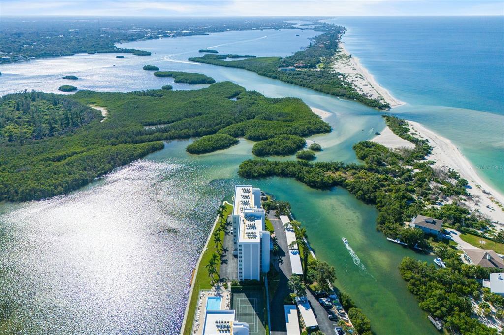 9397 Midnight Pass Road, Unit 905 Sarasota, FL 34242 - Photo 35 of 37 an aerial view of lake residential house with outdoor space