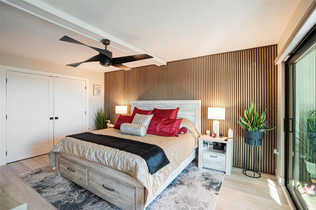 9397 Midnight Pass Road, Unit 905 Sarasota, FL 34242 - Photo 7 of 37 a bedroom with bed and a window