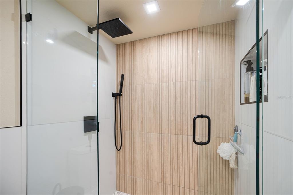 9397 Midnight Pass Road, Unit 905 Sarasota, FL 34242 - Photo 10 of 37 a bathroom with a shower