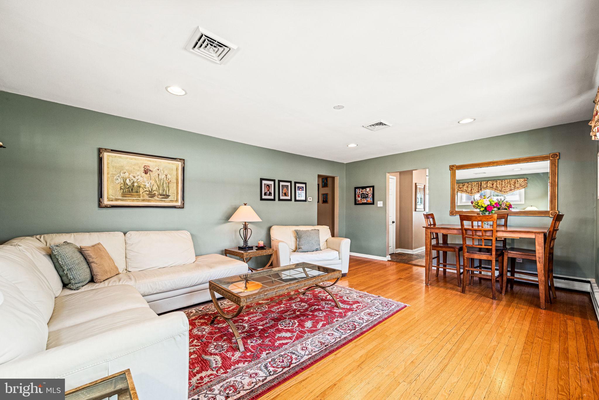 408 Scott Lane Wallingford, PA 19086 - Photo 13 of 39 a living room with furniture rug and wooden floor
