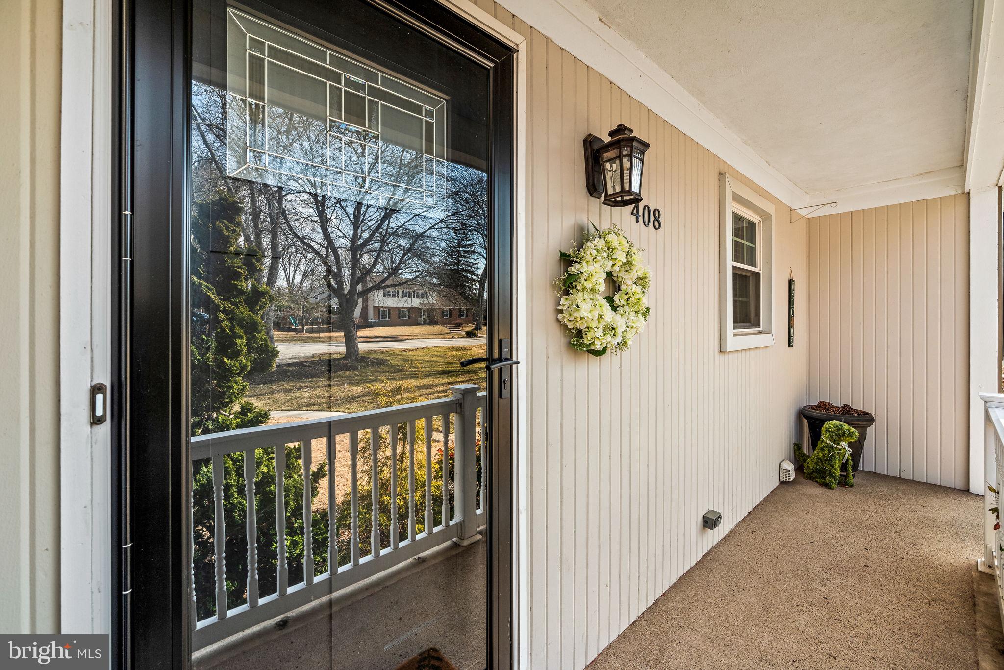 408 Scott Lane Wallingford, PA 19086 - Photo 2 of 39 a view of a balcony and wooden floor