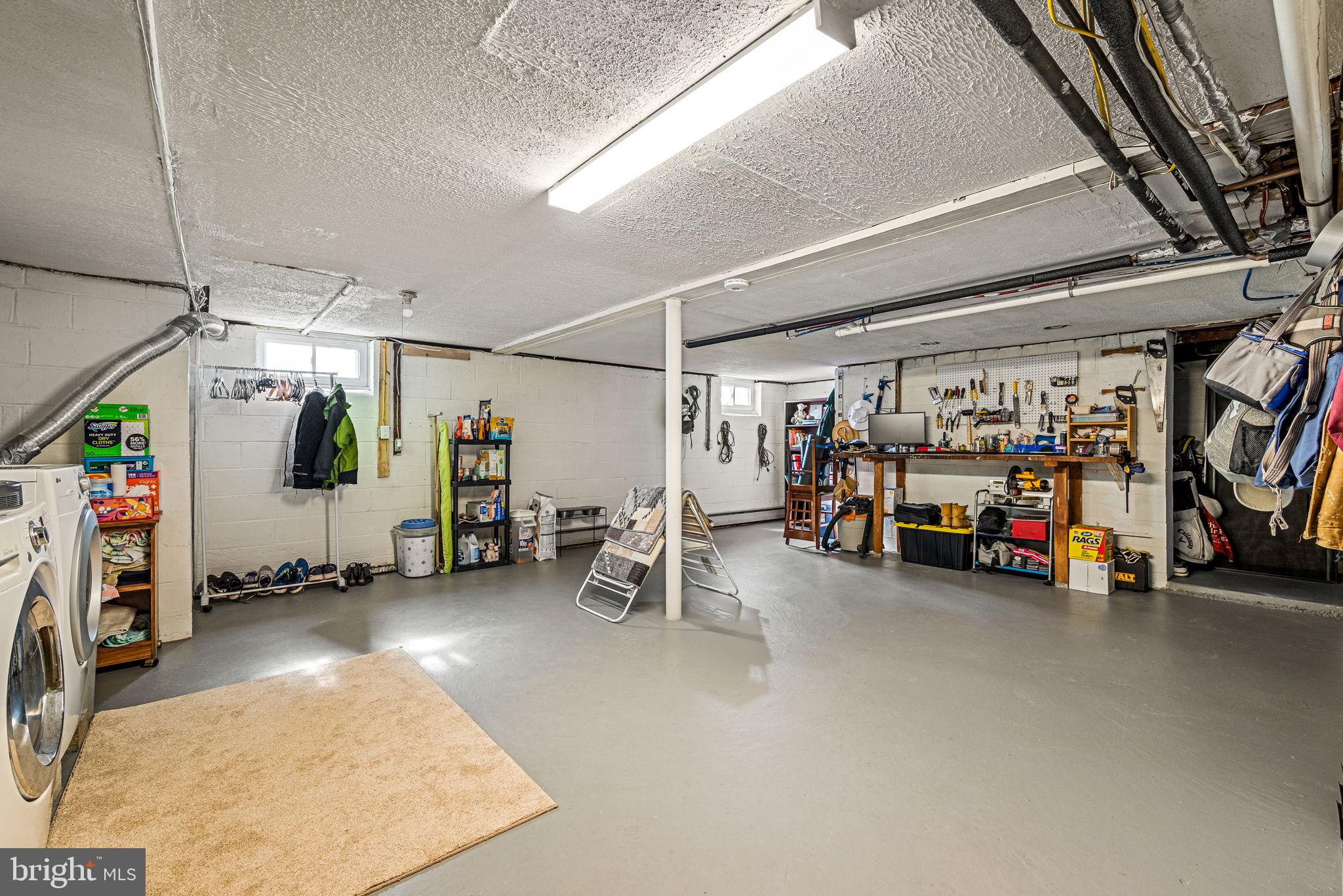 408 Scott Lane Wallingford, PA 19086 - Photo 30 of 39 a view of a garage with parked cars