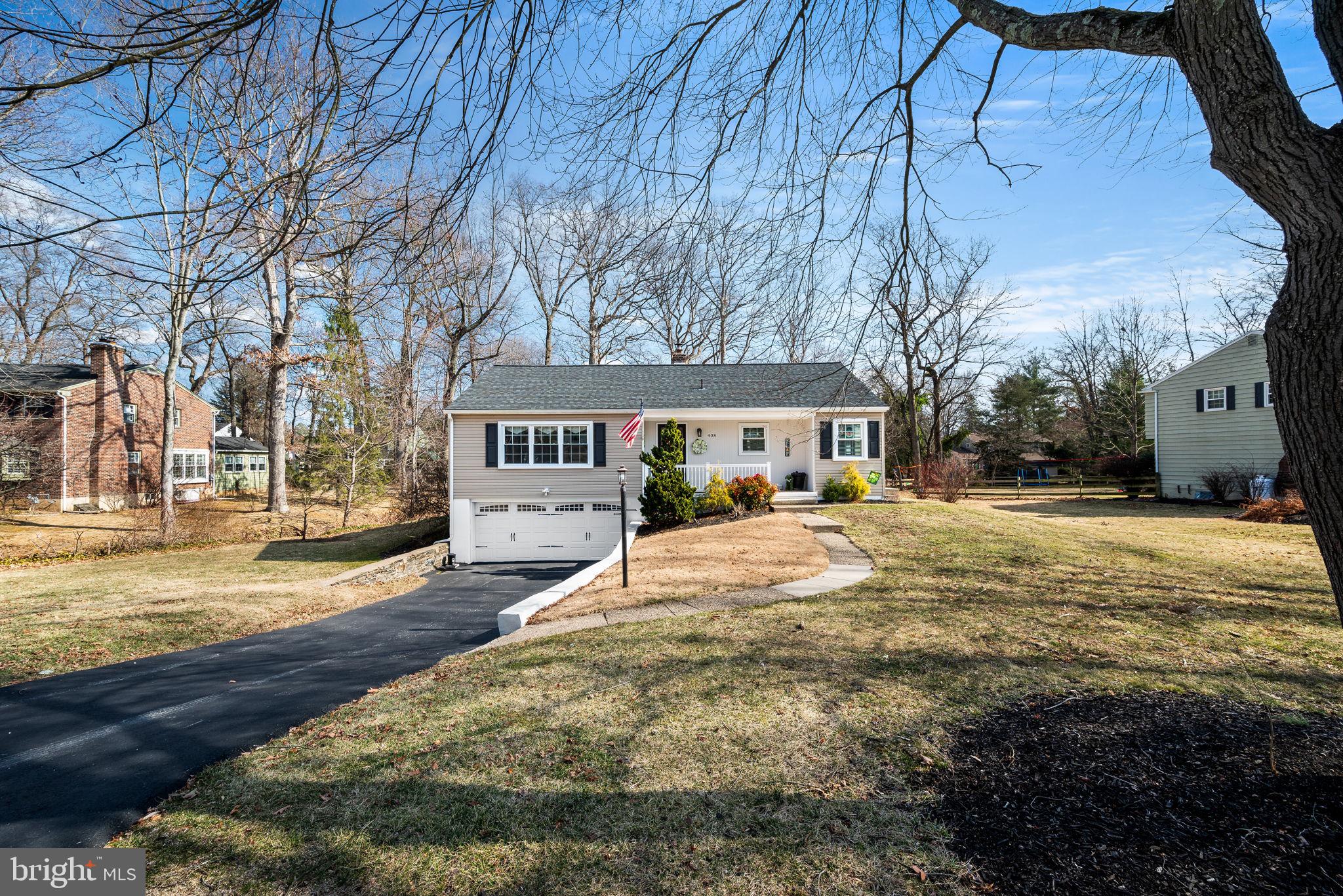 408 Scott Lane Wallingford, PA 19086 - Photo 3 of 39 a house with yard in front of it