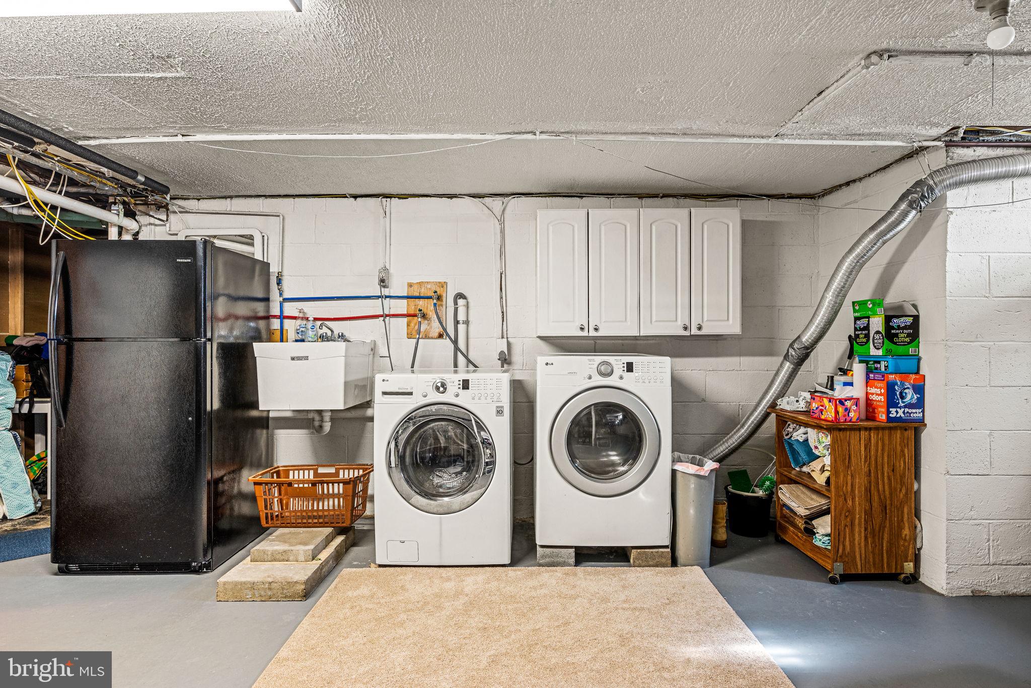 408 Scott Lane Wallingford, PA 19086 - Photo 31 of 39 a utility room with dryer and washer