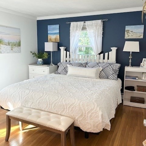 43 Canterbury Road Yarmouth, MA 02675 - Photo 17 of 25 a bedroom with a bed and wooden floor