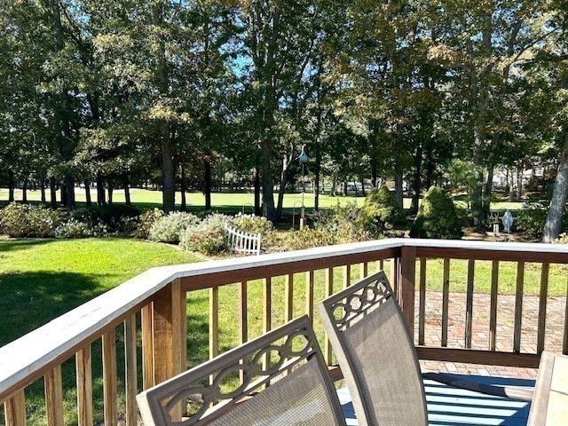 43 Canterbury Road Yarmouth, MA 02675 - Photo 22 of 25 a view of a deck with a yard