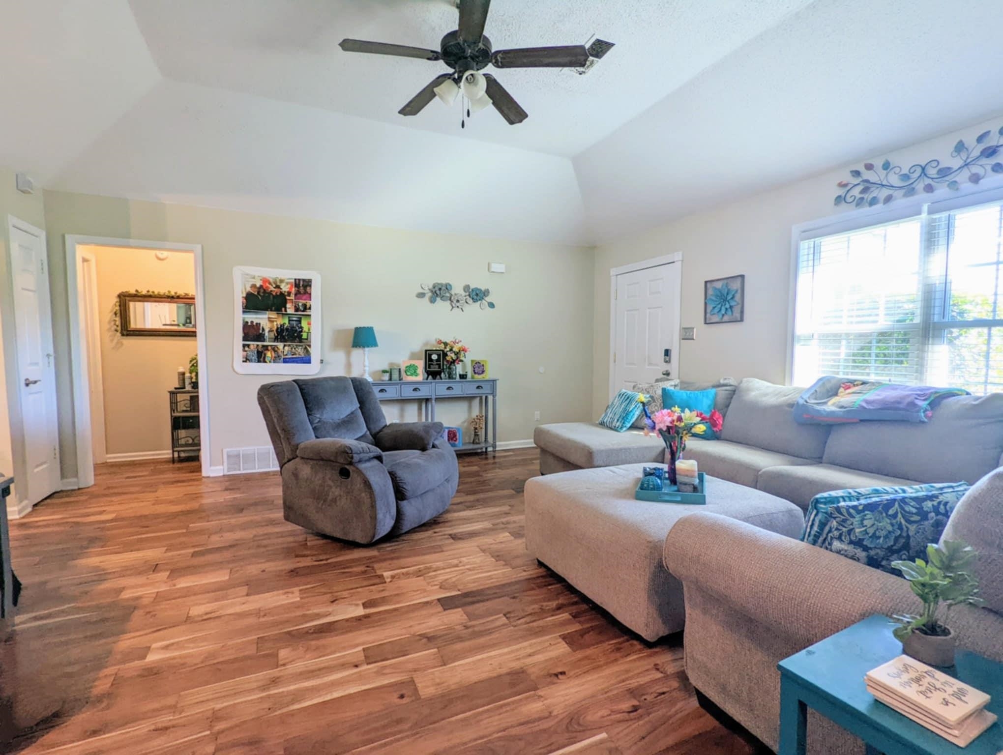 6894 Finch Road Memphis, TN 38141 - Photo 3 of 11 a living room with furniture and a wooden floor
