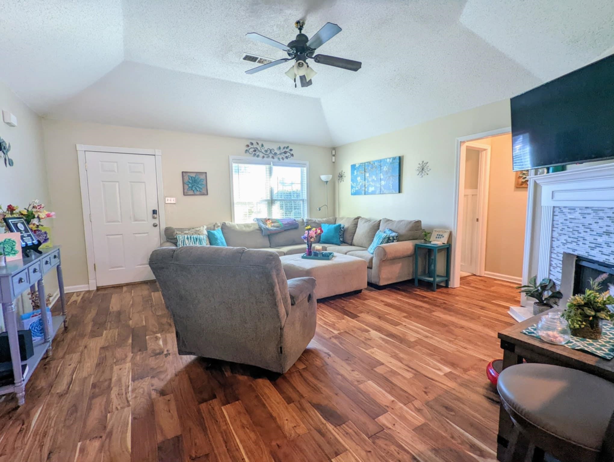 6894 Finch Road Memphis, TN 38141 - Photo 4 of 11 a living room with furniture and a flat screen tv