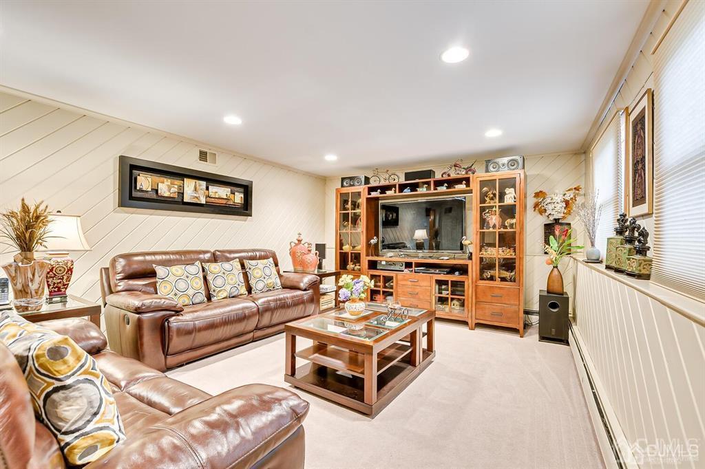 14 Eagle Road Edison, NJ 08820 - Photo 8 of 34 a living room with furniture and a flat screen tv