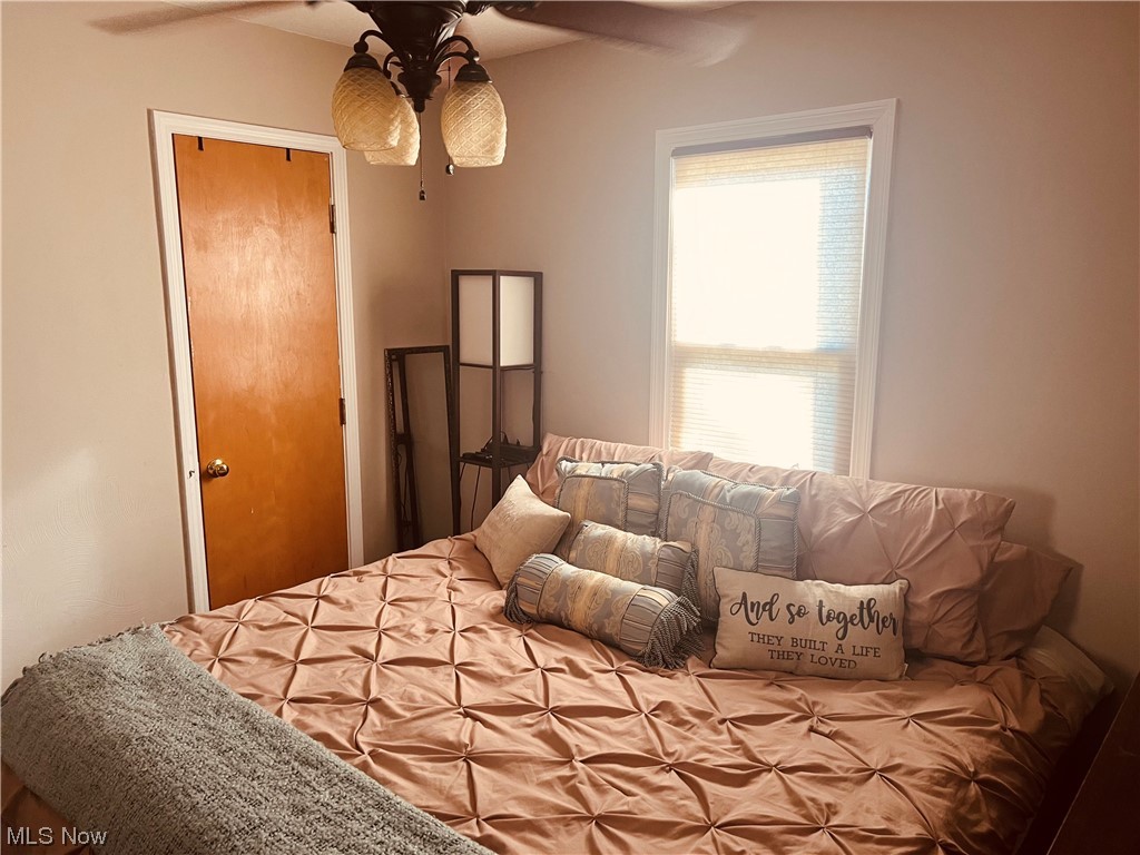 146 Stephens Road Akron, OH 44312 - Photo 22 of 31 Bedroom featuring ceiling fan and a closet