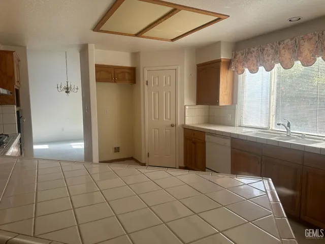 a room with a sink and a mirror