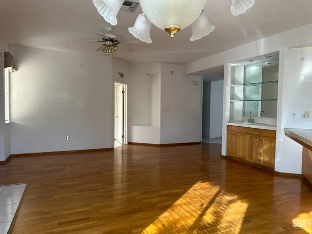 a view of a living room a fireplace and wooden floor