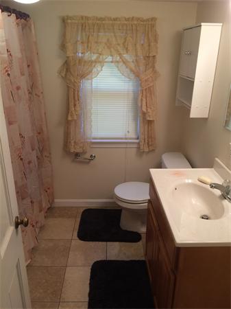 24 Spear Road Springfield, MA 01119 - Photo 8 of 12 a bathroom with a sink a toilet and a mirror