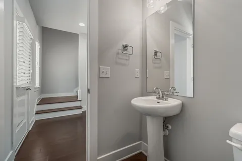 a bathroom with a sink a mirror and a shower