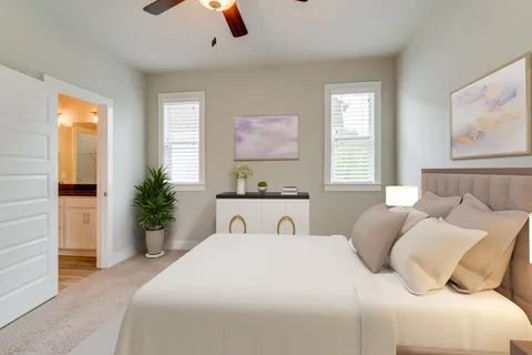 a bedroom with a large bed and a window