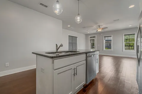 a kitchen with sink and microwave