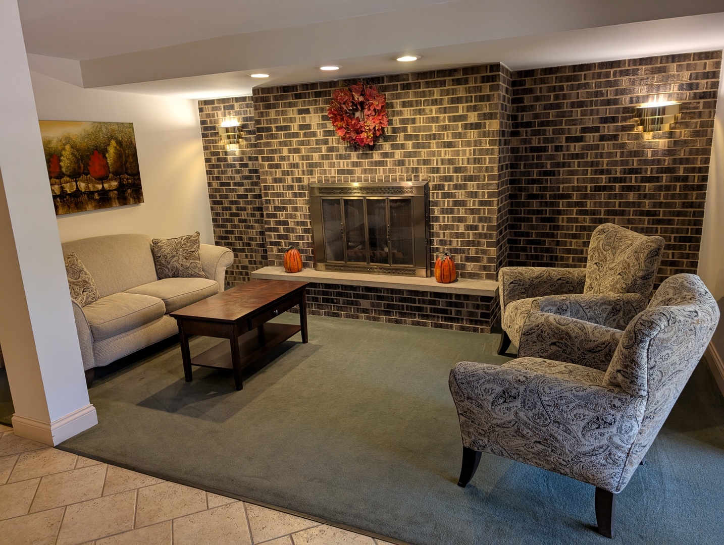 960 South River Road, Unit 208 Des Plaines, IL 60016 - Photo 2 of 11 a living room with furniture and a fireplace