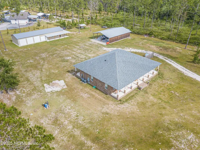 a spacious bedroom with a large bed and a chandelier