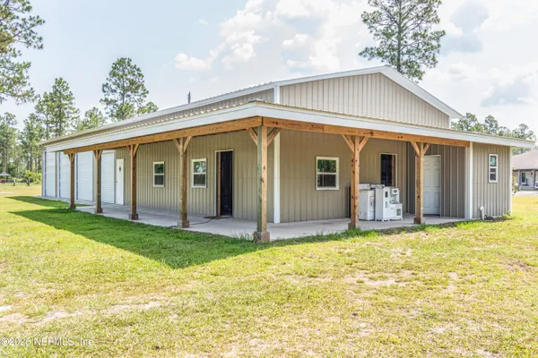 a bathroom with a toilet and a shower curtain