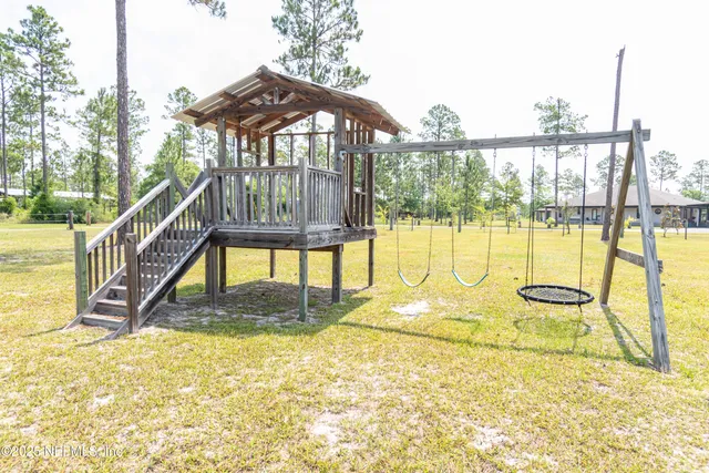 a bedroom with a bed and a television