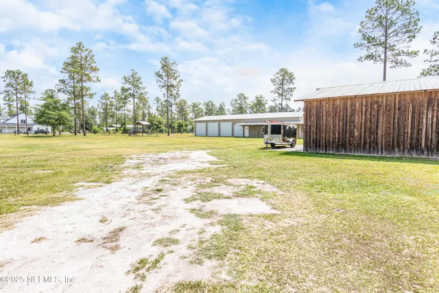 a kitchen with stainless steel appliances a stove a sink and cabinets