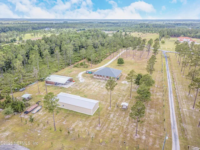 a front view of a house with swimming pool having outdoor seating