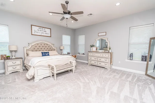 a living room with furniture a wooden floor and next to a window
