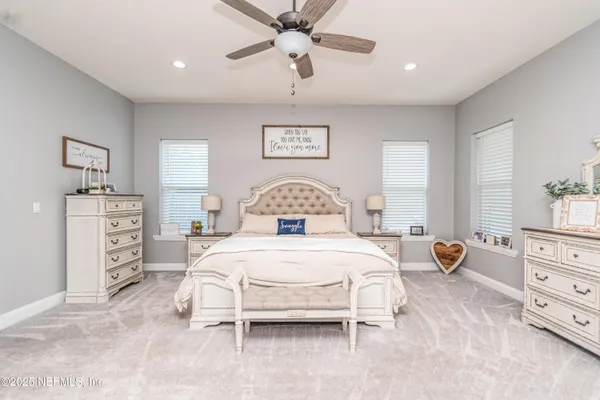 a kitchen with stainless steel appliances a stove a sink and a microwave