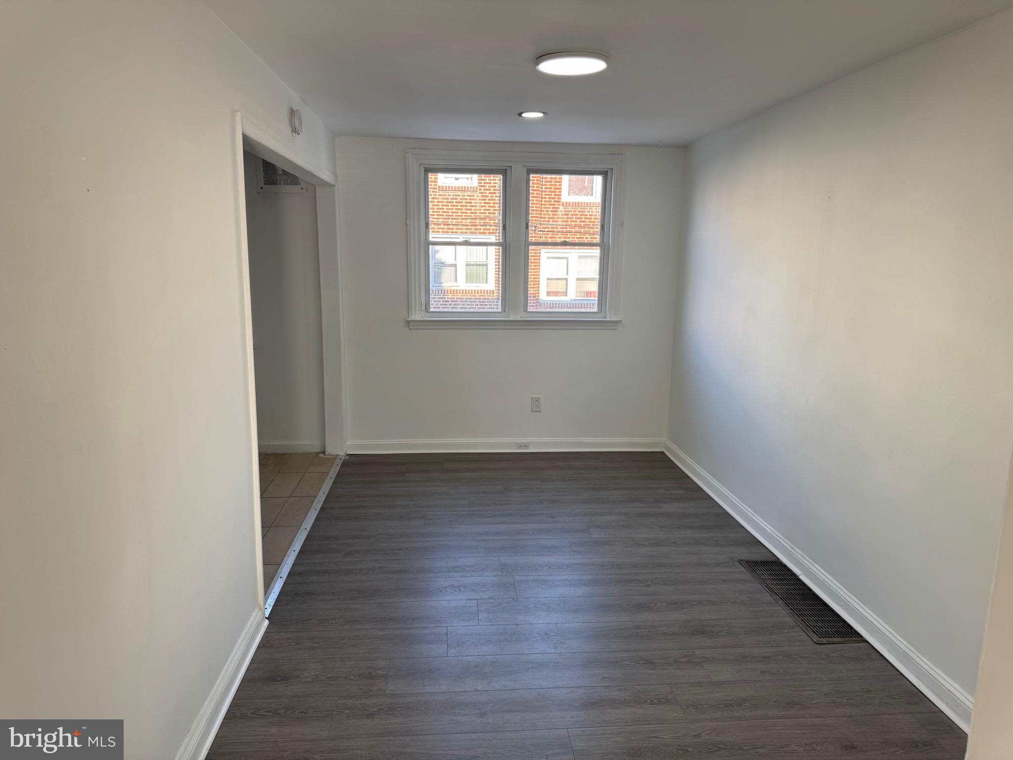 1203 Edgehill Road Darby, PA 19023 - Photo 17 of 24 wooden floor in an empty room with a window