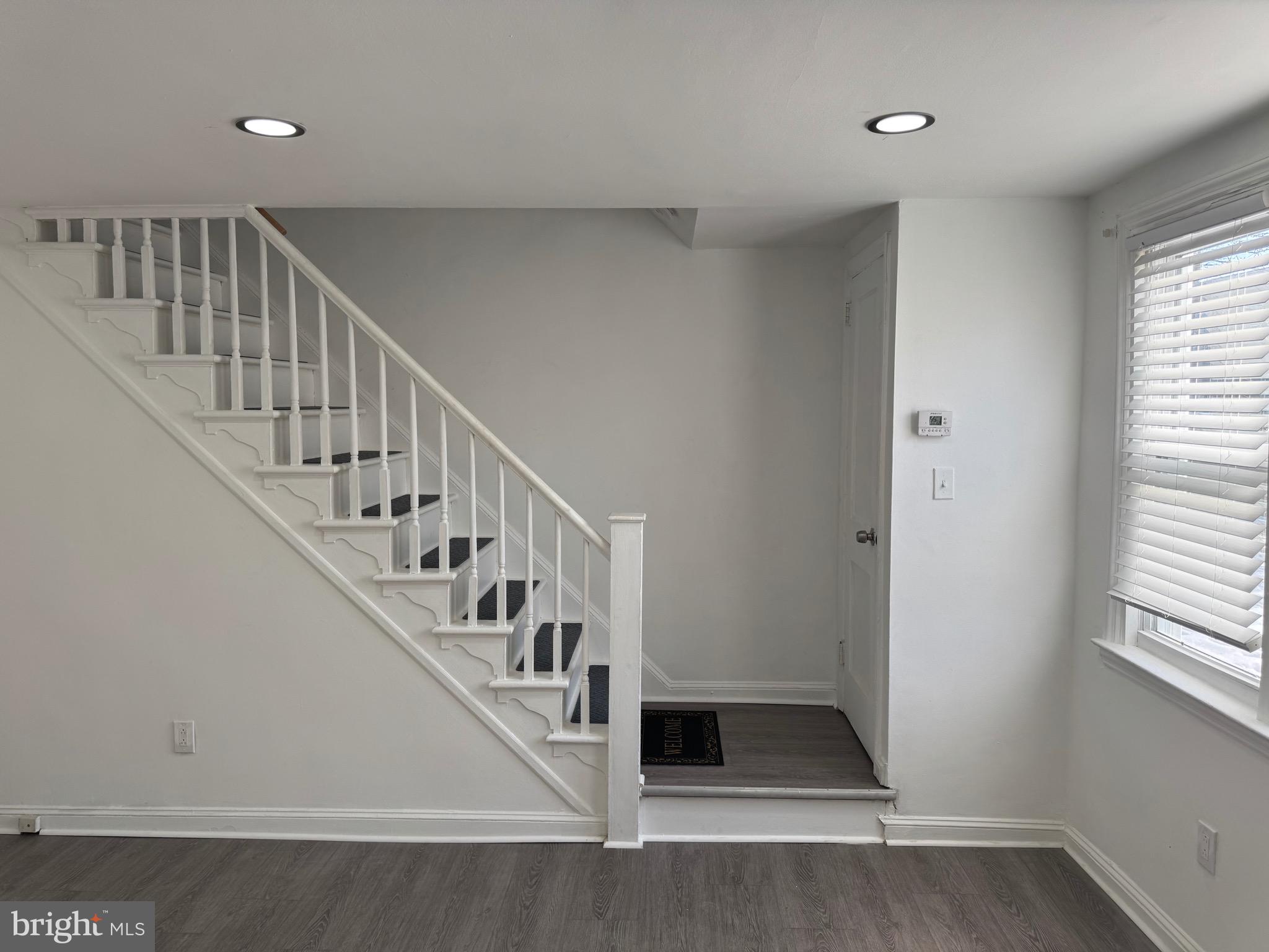 1203 Edgehill Road Darby, PA 19023 - Photo 6 of 24 a view of entryway and hall with wooden floor