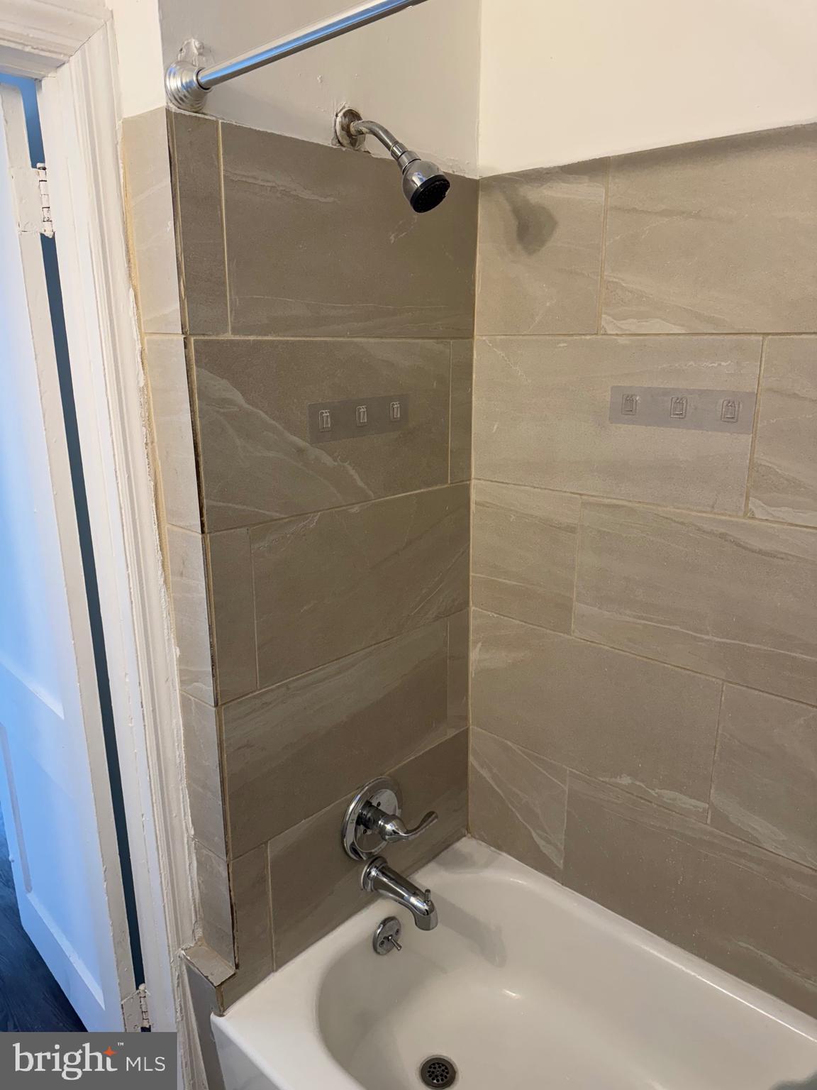 1203 Edgehill Road Darby, PA 19023 - Photo 8 of 24 a bathroom with a sink and shower