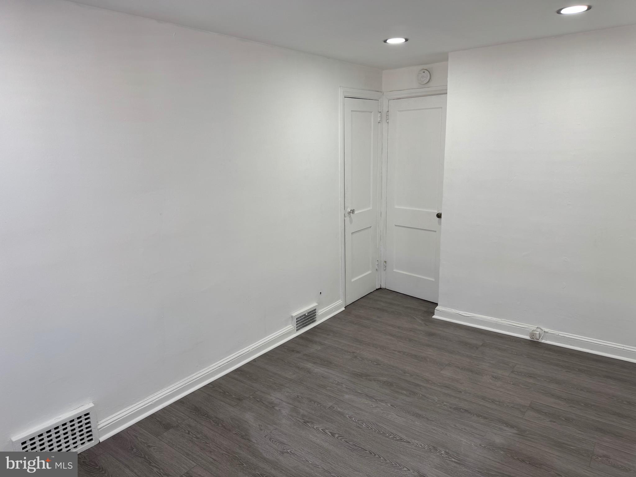 1203 Edgehill Road Darby, PA 19023 - Photo 10 of 24 a view of an empty room with wooden floor