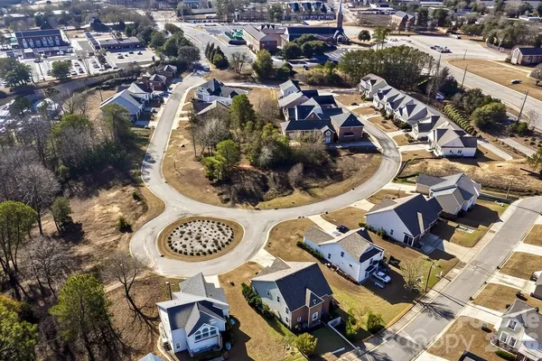 an aerial view of a residential house with a outdoor space