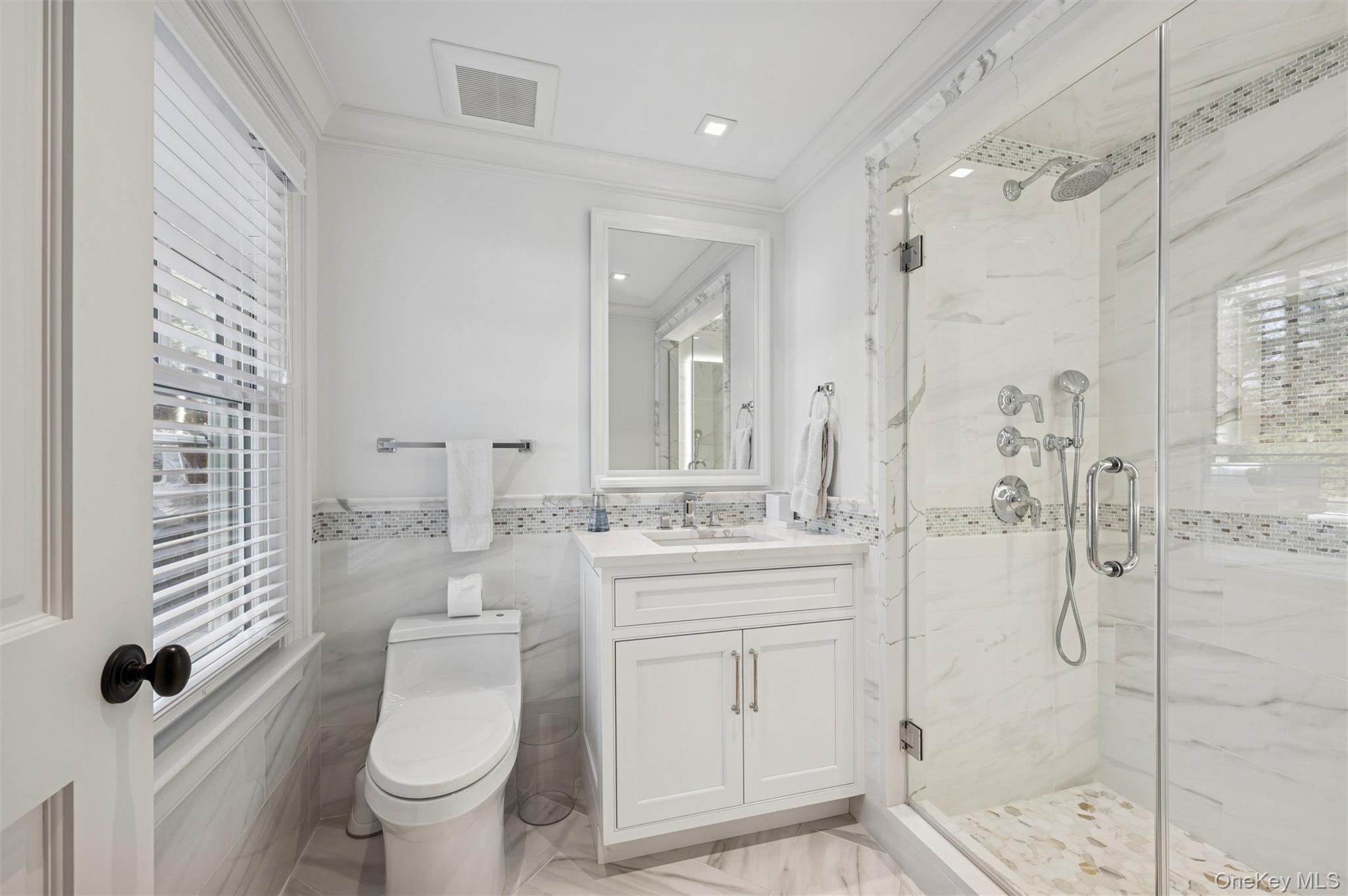30 Club Lane Remsenburg, NY 11960 - Photo 11 of 19 a bathroom with a granite countertop sink a toilet a mirror and shower