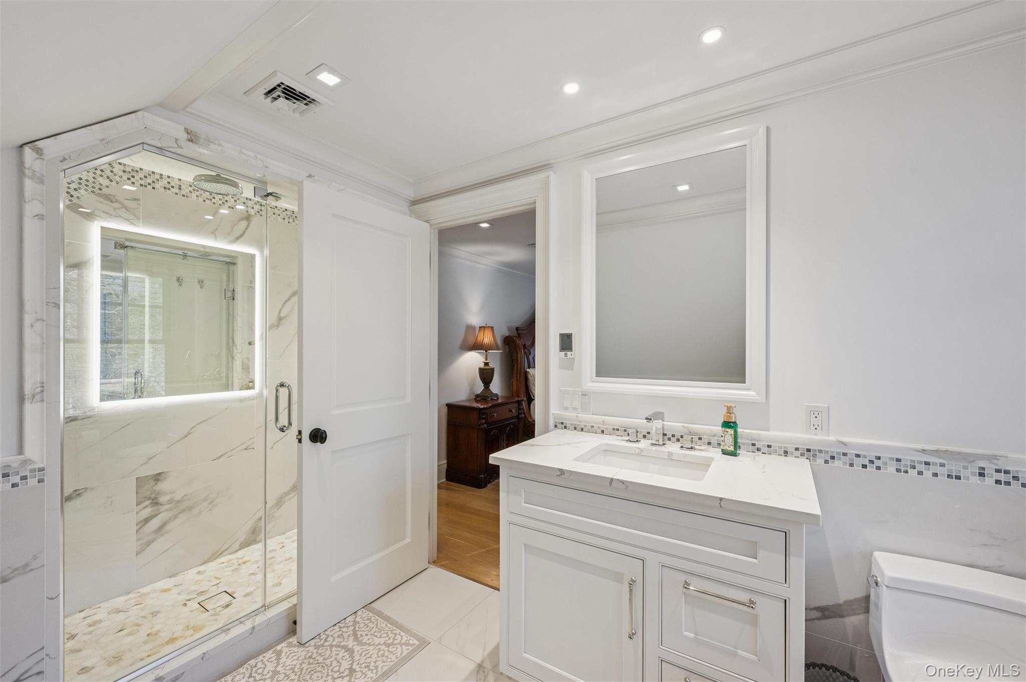 30 Club Lane Remsenburg, NY 11960 - Photo 13 of 19 a bathroom with a sink a toilet and shower