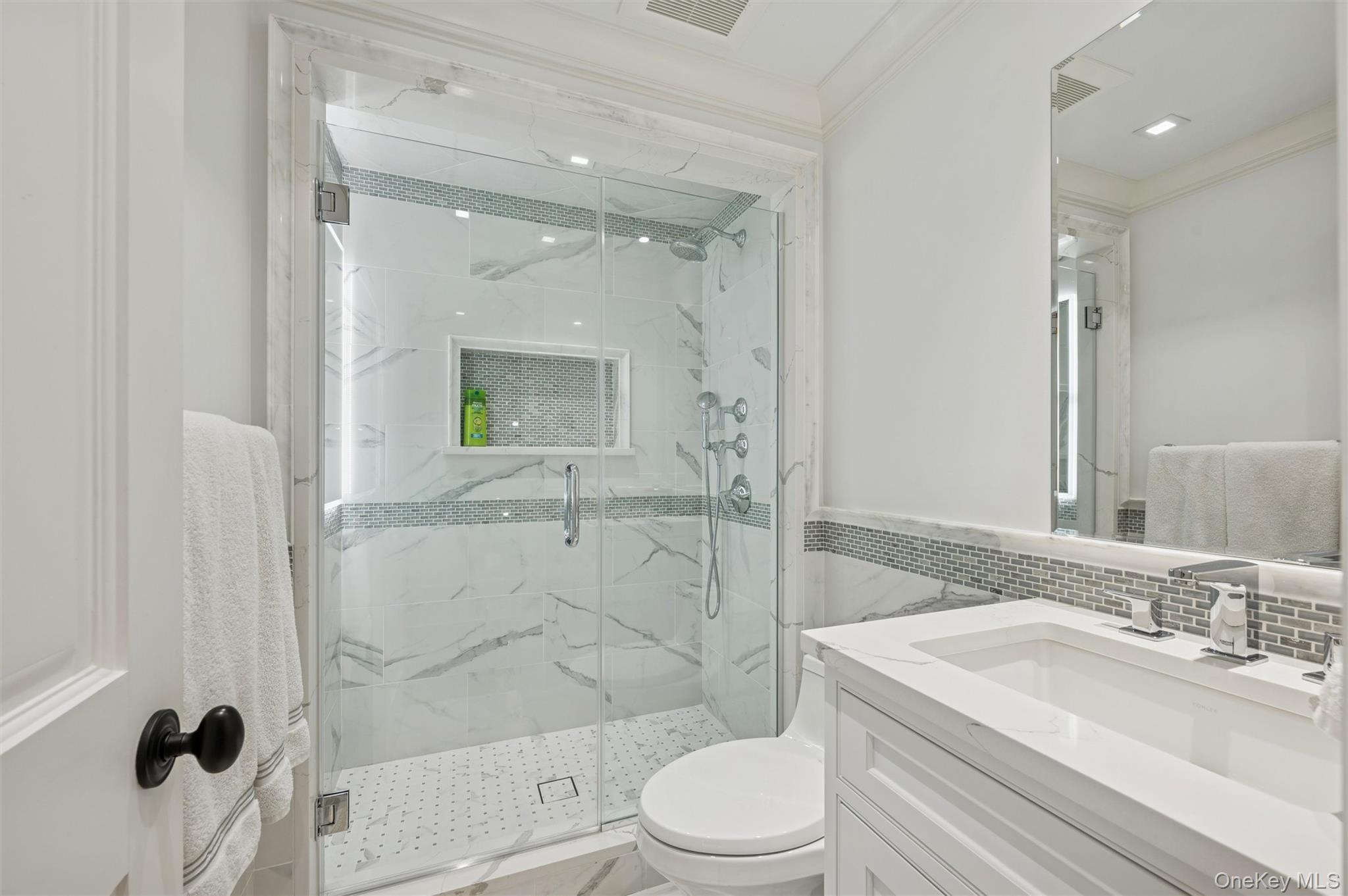 30 Club Lane Remsenburg, NY 11960 - Photo 16 of 19 a bathroom with a sink a toilet and shower