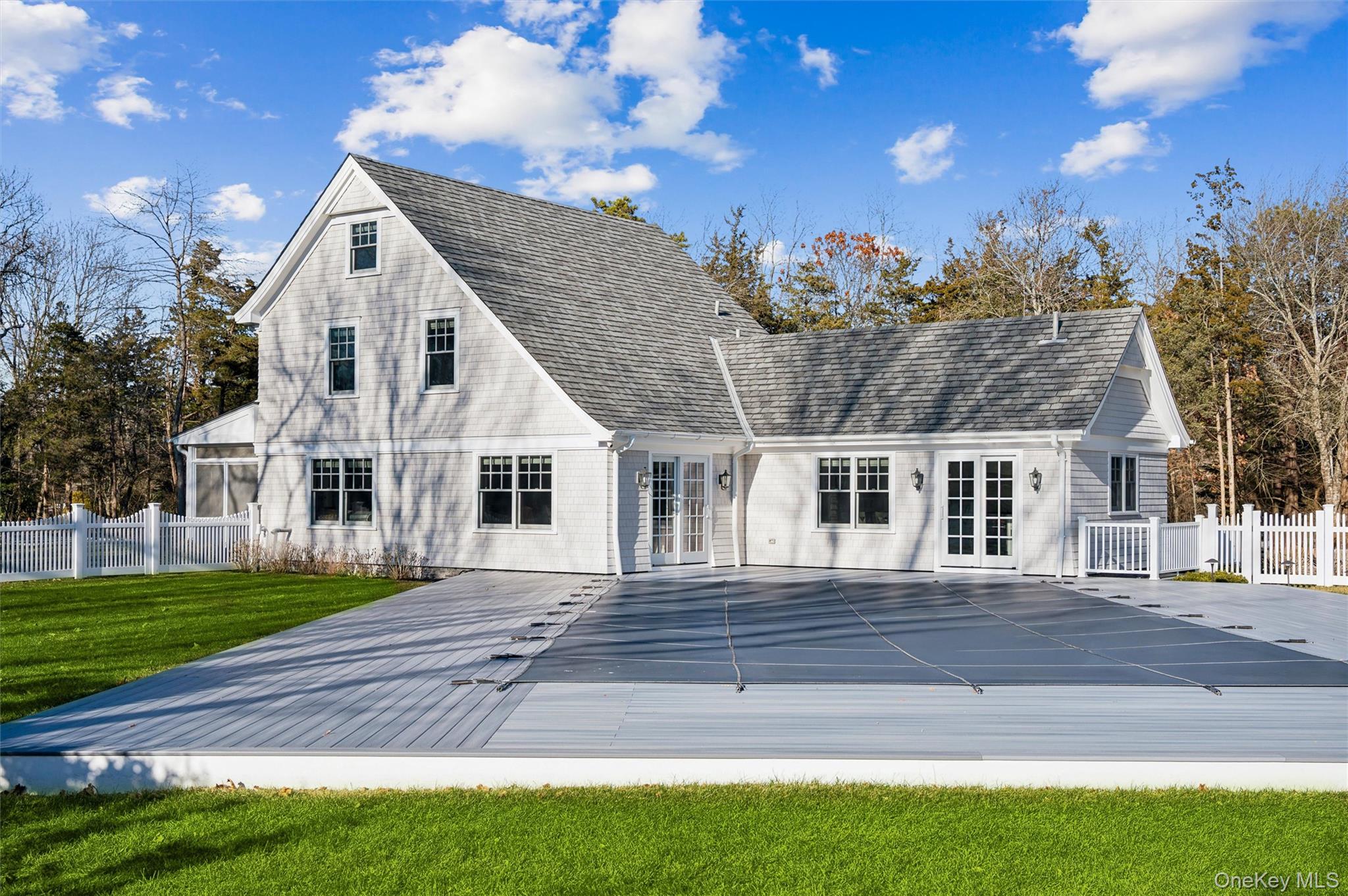 30 Club Lane Remsenburg, NY 11960 - Photo 18 of 19 a front view of a house with a yard